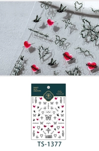 Close-up of gothic nail stickers with red thorns, black butterflies and barbwire patterns