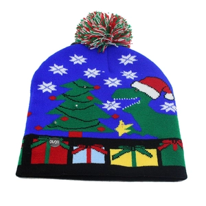 Detail view of the colorful LED power switch on a blue knitted dinosaur Christmas hat