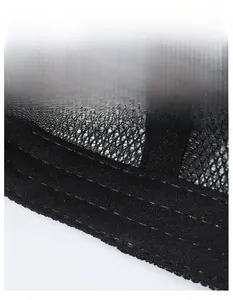 Macro detail of breathable black mesh fabric and widened sweatband on sports baseball cap