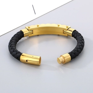 Detail view of woven leather bracelet featuring a gold stainless steel magnetic buckle