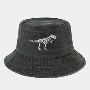 Detailed embroidery of dinosaur skeleton on washed grey denim bucket hat with metal eyelets
