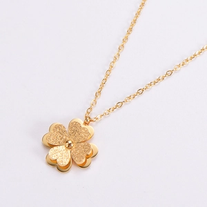Gold titanium steel four-leaf clover pendant necklace with a fine sandblasted texture finish
