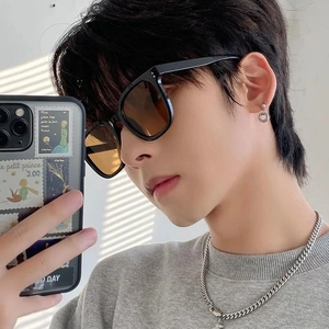 Fashionable black thick rectangular sunglasses with silver rivets for a trendy look