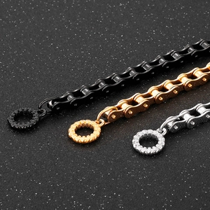 Detailed close-up of heavy stainless steel bike chain bracelets in black, gold and silver