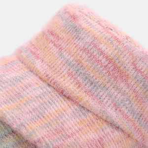Detailed close-up of pink multicolor mixed knit fabric showing soft texture and fine weaving
