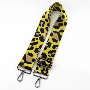 Close-up of leopard print shoulder strap with black nickel metal spring hooks and buckle