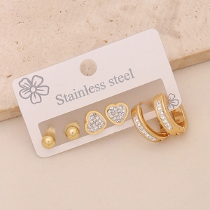 Three pairs of gold stainless steel stud earrings with crystal heart and moon designs