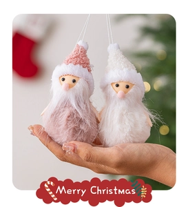 Detail of plush Santa Claus ornaments with white beards and cozy knitted textures