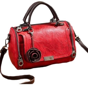 Vintage red Boston bag in oil wax leather with rose pendant and adjustable shoulder strap