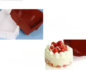 Detail view of heart-shaped silicone cake mold in white and red with finished pastry