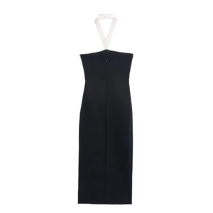 Elegant black midi bodycon dress with a white halter neck and bow detail on plain background