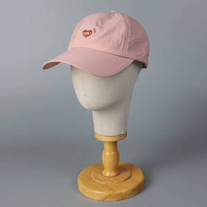 Pink quick-dry baseball cap with heart 'FAMILY' embroidery on a mannequin head