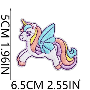 Colorful embroidered unicorn patch with wings and meteor shower details on white background