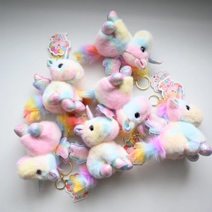 Plush rainbow unicorn keychain with golden wings and heart details for gift