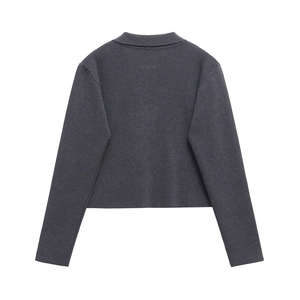Detail view showing back of dark gray long sleeve knitted jacket with fine texture