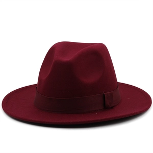 Detail of burgundy wool fedora with matching grosgrain ribbon and buckle detail