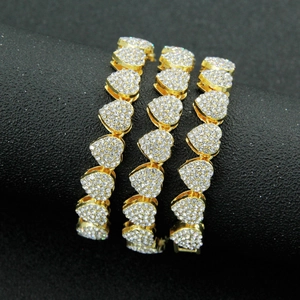 Three rows of gold plated Cuban link necklaces with iced-out heart shaped links