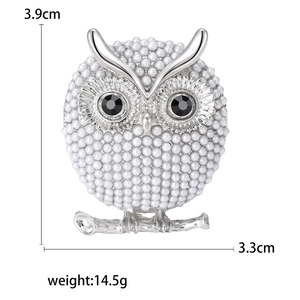 Elegant owl brooch with white pearls and black gemstone eyes on silver alloy base