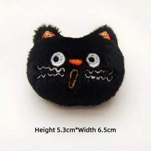 Detailed plush black cat brooch with embroidery, dimensions 5.3cm height by 6.5cm width