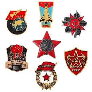 Set of seven vintage Soviet style metal star pins with CCCP emblems on white background