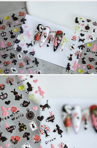Detailed macro view of 5D embossed nail art stickers with Alice in Dreamworld theme