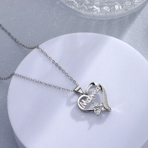 Silver heart pendant necklace with Mama inscription and cubic zirconia butterfly accent