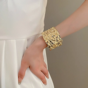 Statement wide gold metal cuff bracelet with crinkled geometric liquid metal texture