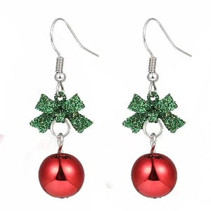 Detail of Christmas earrings featuring green glitter bows and red ball drop pendants