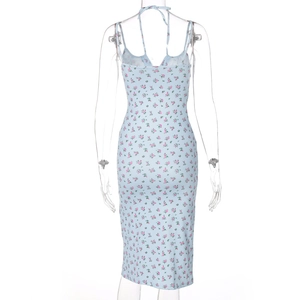 Detailed back view of a light blue floral summer dress with lace-up straps and slit design