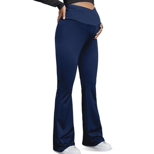 Detail showing the V-shaped cross-over high waist support on navy yoga maternity flare pants