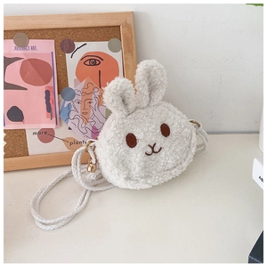 Detail of white plush rabbit crossbody bag with soft faux fur and braided rope strap