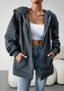 Detail of dark grey zip-up hoodie featuring soft fleece fabric and a relaxed loose fit