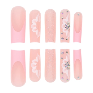 Pink long trapezoid press-on nails with floral designs, glitters and 3D rhinestones