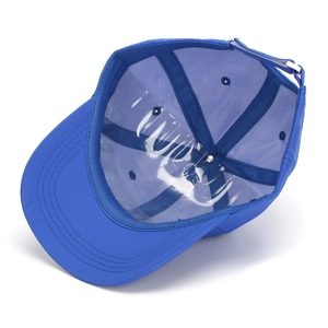 Detail of blue kids baseball cap showing internal structure and adjustable metal buckle