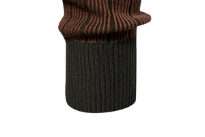 Macro shot of striped knit sweater cuff with high-elasticity black ribbed detailing