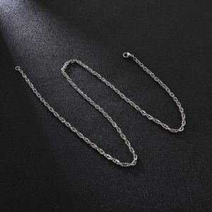 Close-up of a silver titanium steel rope chain necklace with a secure lobster clasp