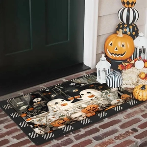 Close-up of Halloween diatomite bath mat featuring ghost and pumpkin designs at doorstep