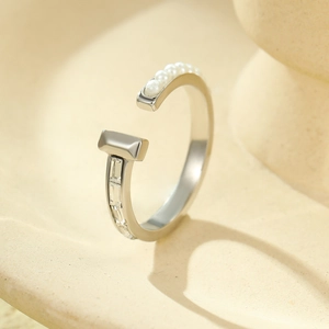 Fashionable titanium steel open ring featuring white pearls and clear gemstones on a silver band