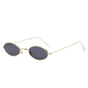 Retro small oval sunglasses with slim gold metal frame and dark grey ocean lenses
