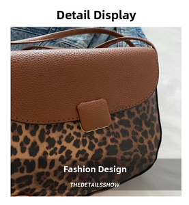 Detail of leopard print patchwork saddle bag featuring pebbled leather and stitching