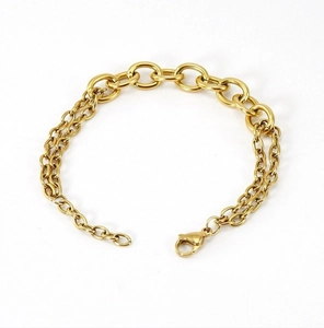 Detail of gold double-layered stainless steel chain bracelet with a lobster clasp closure