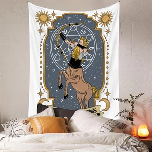 Detail of Sagittarius tapestry with golden archer design and astrology symbols in bedroom