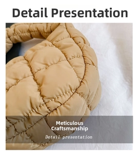 Macro shot of quilted beige fabric texture on mini cloud handbag with precise stitching