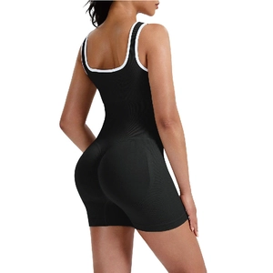 Black ribbed seamless fitness bodysuit with white contrast edges and U-shaped open back