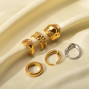 Set of six gold and silver 18k plated stainless steel rings with hammer and spiral textures