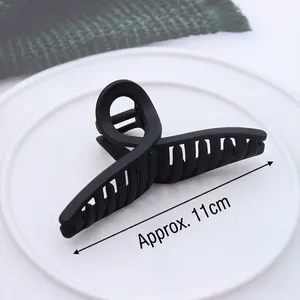 Morandi black matte large hair claw clip 11cm length shown on white plate background