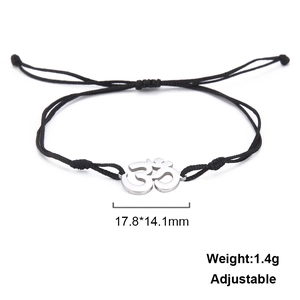 Detail of adjustable black cord bracelet with stainless steel Om symbol pendant