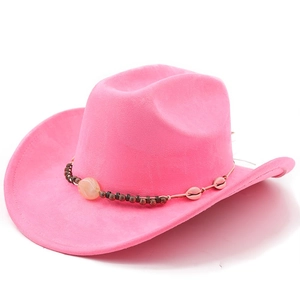 Detailed close-up of pink suede cowboy hat with ethnic beads and shell ornaments