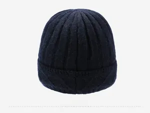 Close-up back view of a navy blue ribbed knit beanie hat for women, showing texture