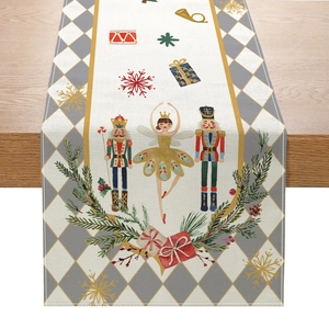 Christmas Nutcracker and Ballerina table runner with festive holiday patterns on wood surface